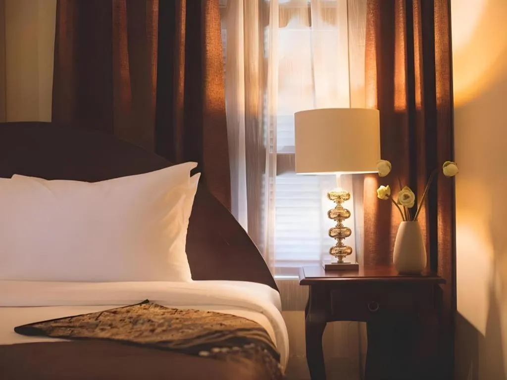 Bed in Le Luxe Boutique Hotel