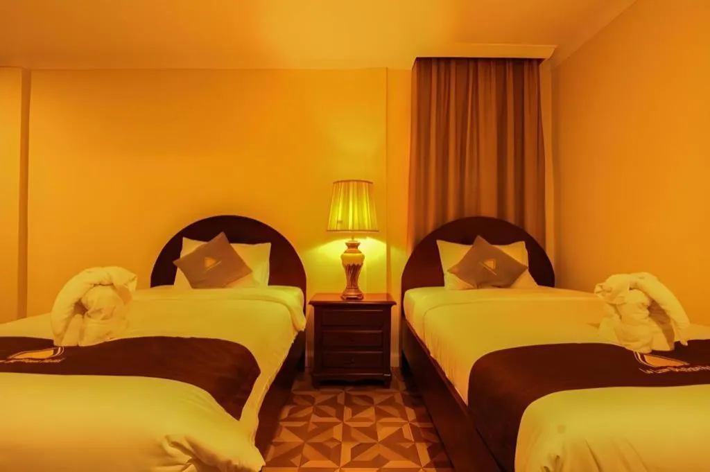 Bed in Le Luxe Boutique Hotel