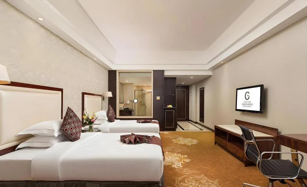 Bed in Country Garden Phoenix Hotel Maoming