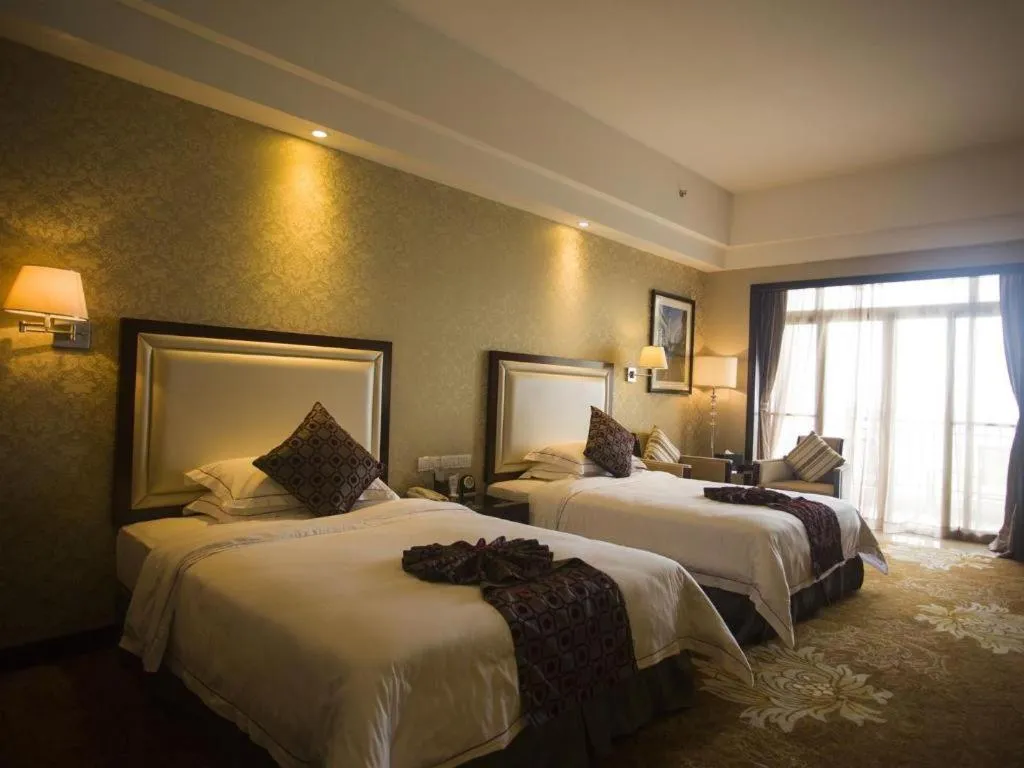 Bed in Country Garden Phoenix Hotel Maoming