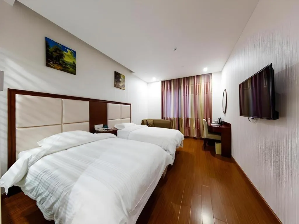 Bed in GreenTree Inn Jiangsu Zhangjiagang Jingang Town Darunfa Express Hotel
