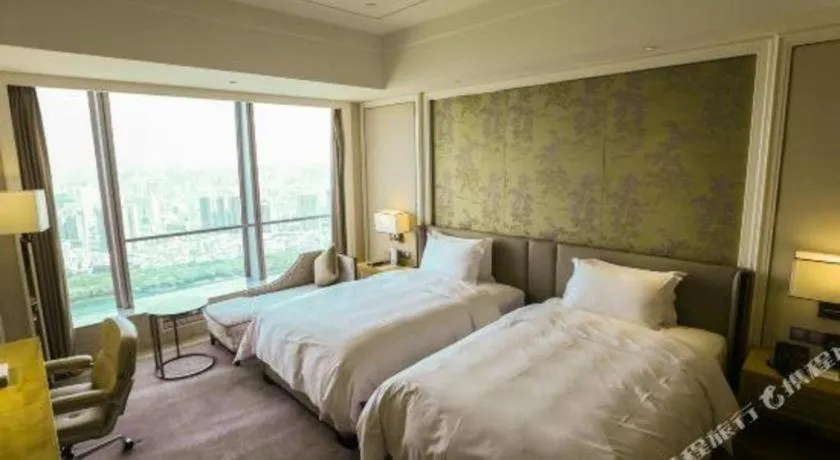 Bed in Ming Du Lakeside Hotel Nanning