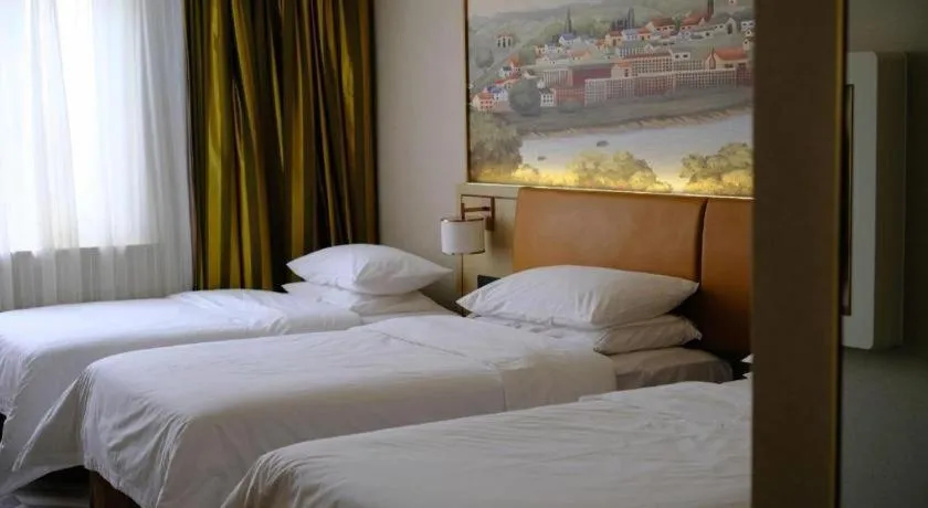 Bed in Vienna Hotel Tianjin Huaming