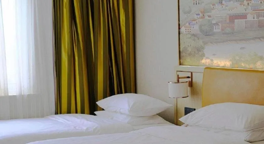 Bed in Vienna Hotel Tianjin Huaming