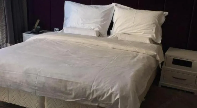Bed in Harbin Ju Jian Hotel