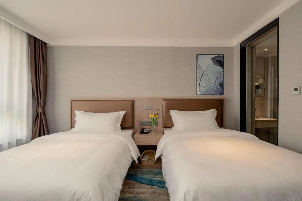 Bed in GreenTree Inn Ganzhou Sankang Temple DaRunFa Express Hotel