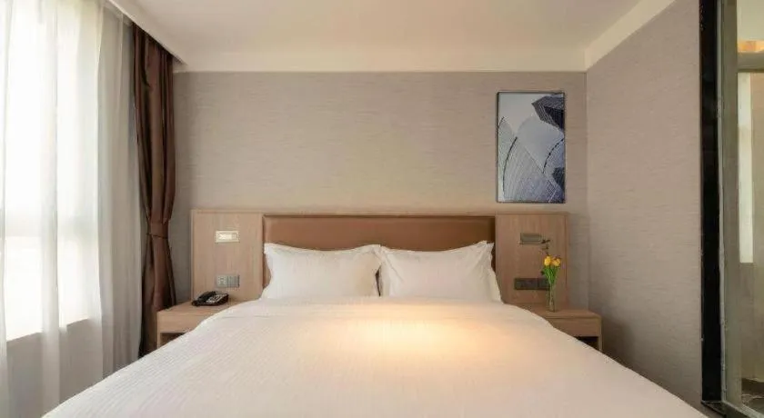 Bed in GreenTree Inn Ganzhou Sankang Temple DaRunFa Express Hotel