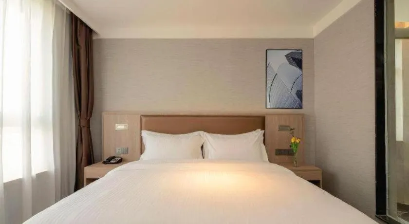 Bed in GreenTree Inn Ganzhou Sankang Temple DaRunFa Express Hotel