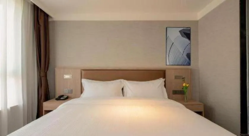 Bed in GreenTree Inn Ganzhou Sankang Temple DaRunFa Express Hotel