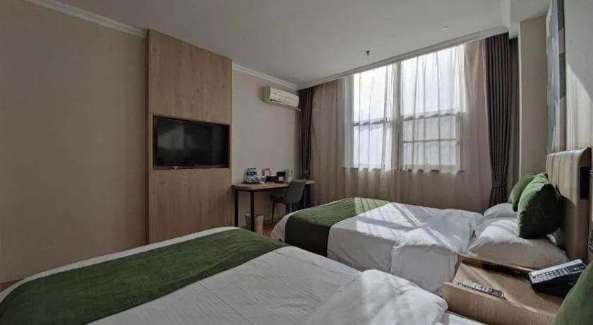 Bed in GreenTree Inn Xuzhou High Speed Railway Station Express Hotel