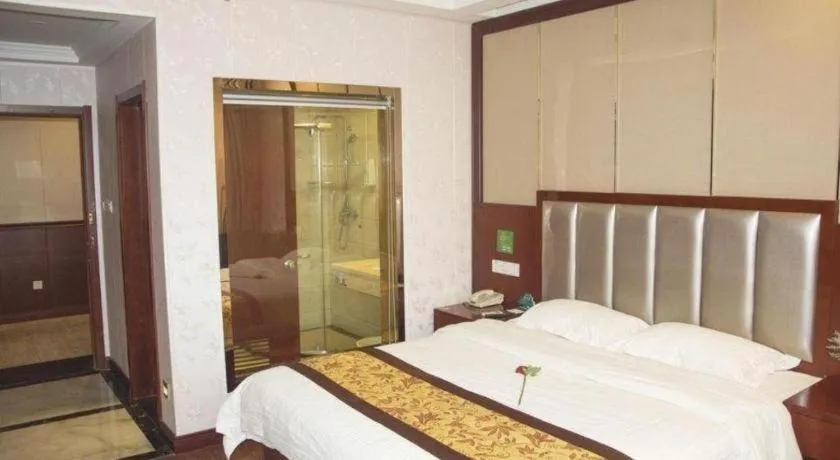 Bed in GreenTree Inn JiangSu Wuxi Jiangyin City QinGYAng Town Fuqian Road Express Hotel