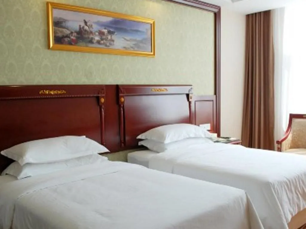 Bed in Vienna Hotel Qingdao Jiaozhou Branch