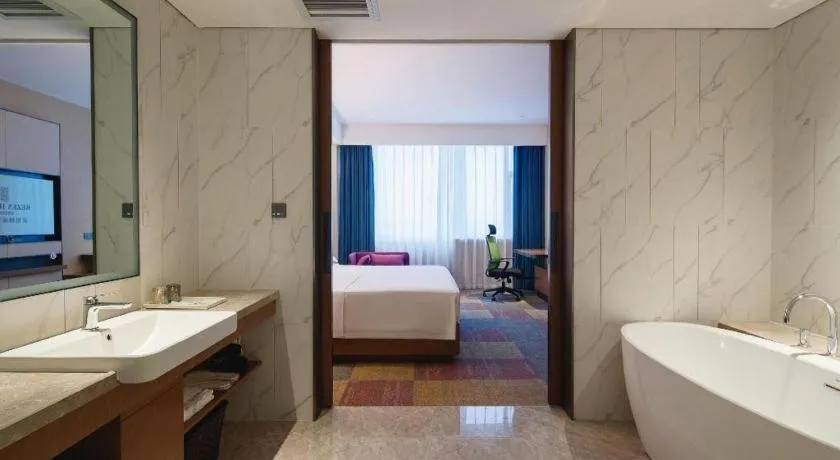 Bed in Vienna Hotel Qingdao Jiaozhou Branch