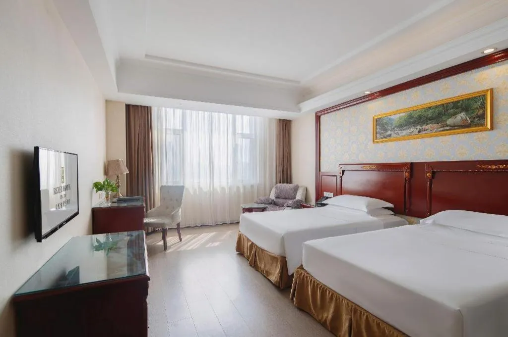 Bed in Vienna Hotel Qingdao Jiaozhou Branch
