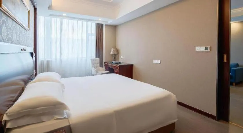 Bed in Vienna Hotel Qingdao Jiaozhou Branch