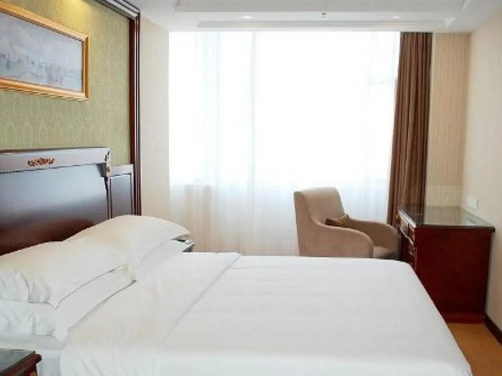Bed in Vienna Hotel Qingdao Jiaozhou Branch