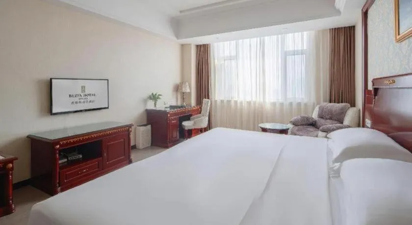 Bed in Vienna Hotel Qingdao Jiaozhou Branch