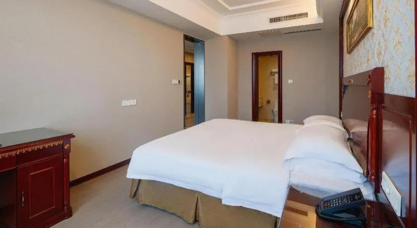 Bed in Vienna Hotel Qingdao Jiaozhou Branch