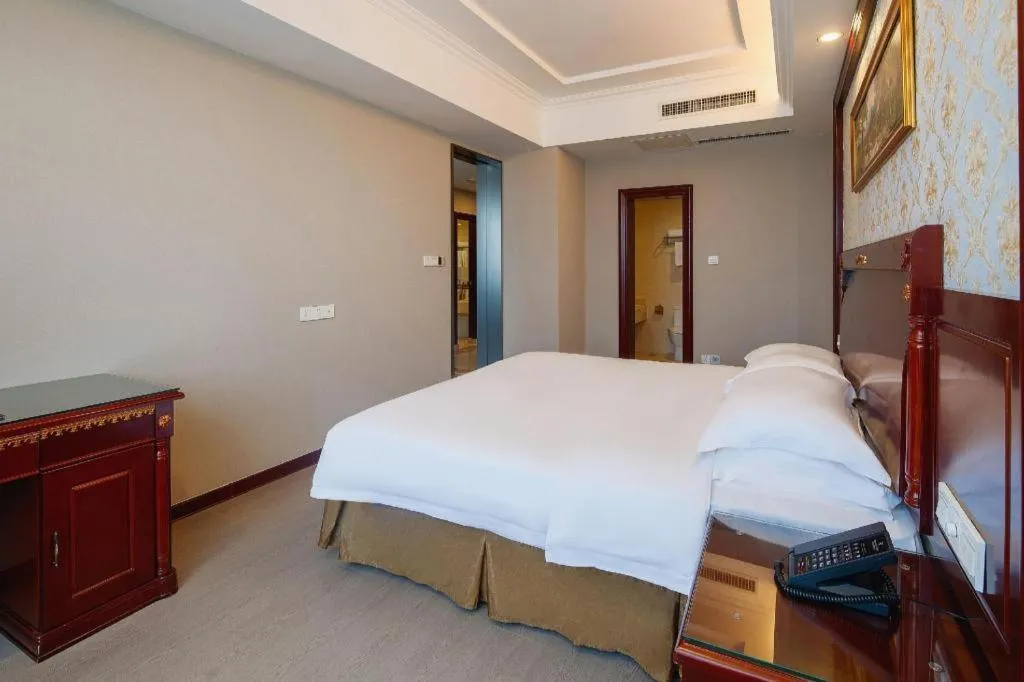 Bed in Vienna Hotel Qingdao Jiaozhou Branch