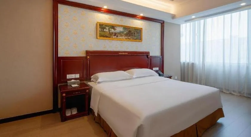 Bed in Vienna Hotel Qingdao Jiaozhou Branch
