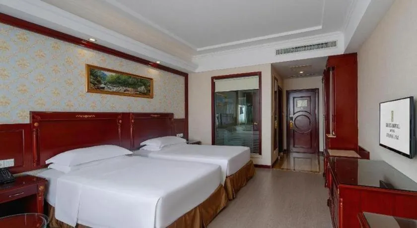 Bed in Vienna Hotel Qingdao Jiaozhou Branch