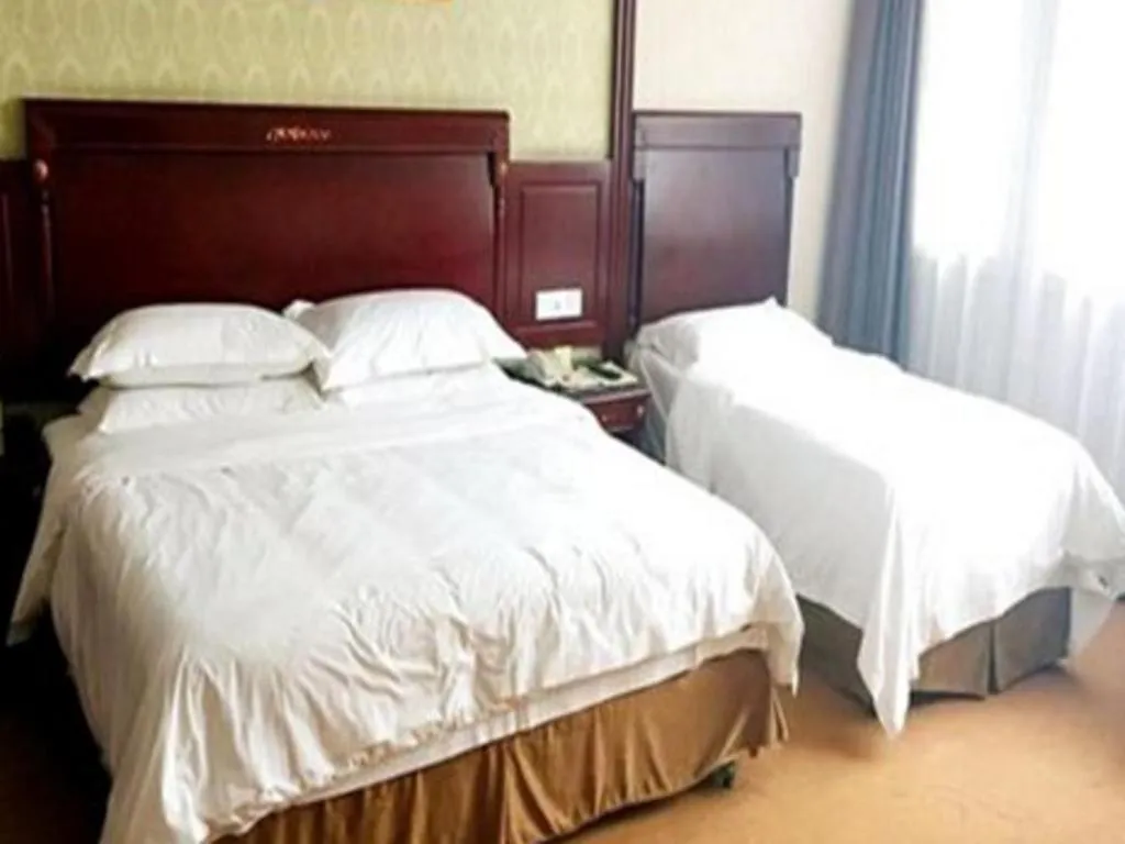 Bed in Vienna Hotel Qingdao Jiaozhou Branch