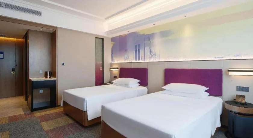 Bed in Vienna Hotel Qingdao Jiaozhou Branch
