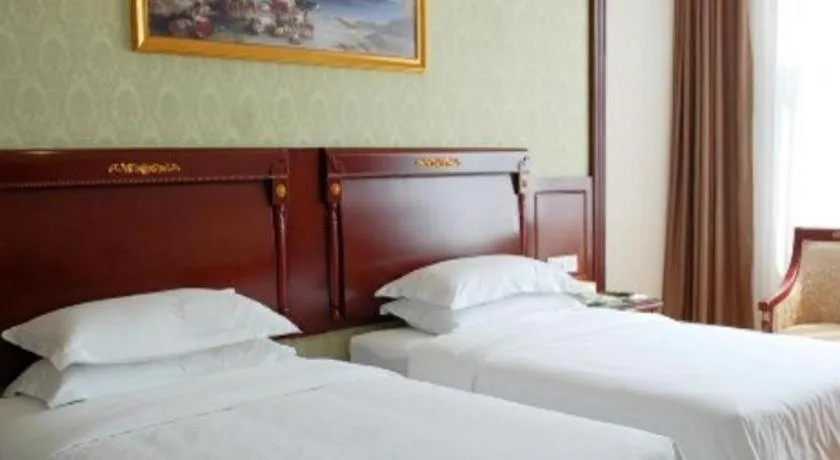 Bed in Vienna Hotel Qingdao Jiaozhou Branch