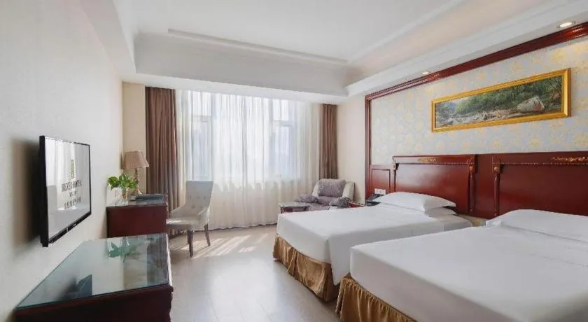 Bed in Vienna Hotel Qingdao Jiaozhou Branch