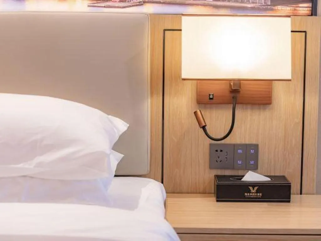 Bed in Vienna International Hotel Guangzhou Baiyun Dayuanli Plaza