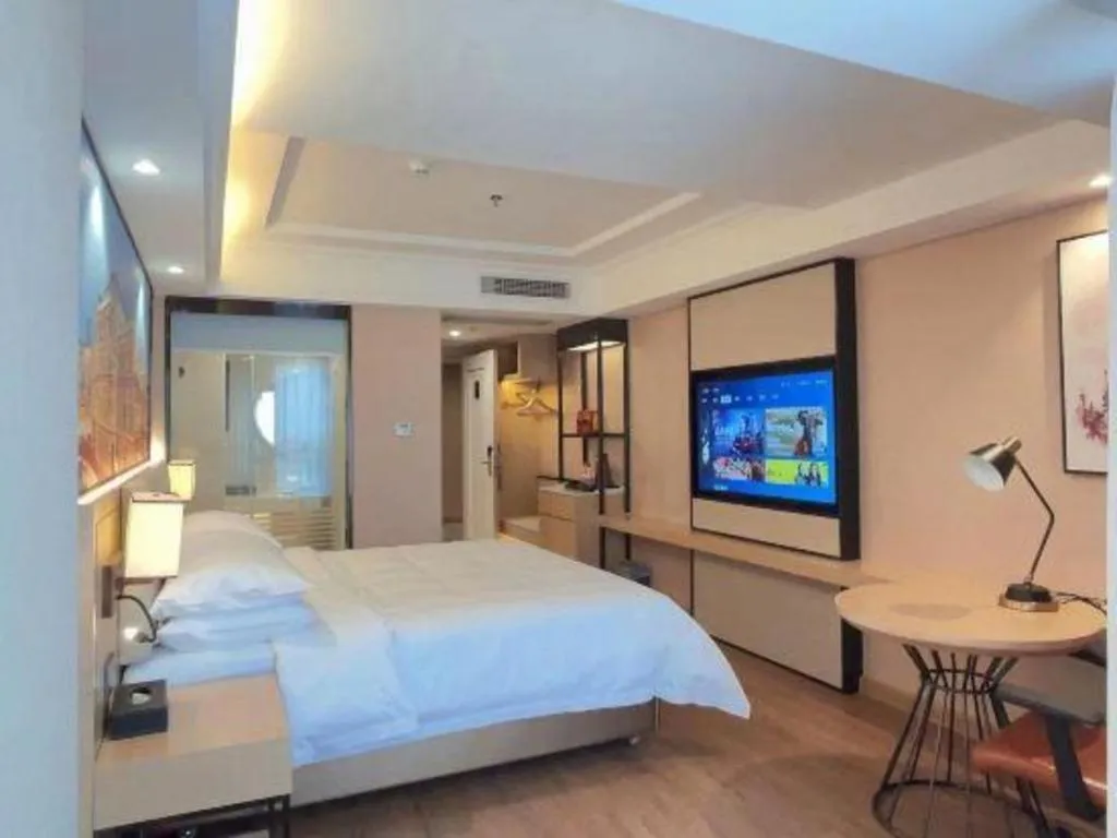 Bed in Vienna International Hotel Guangzhou Baiyun Dayuanli Plaza