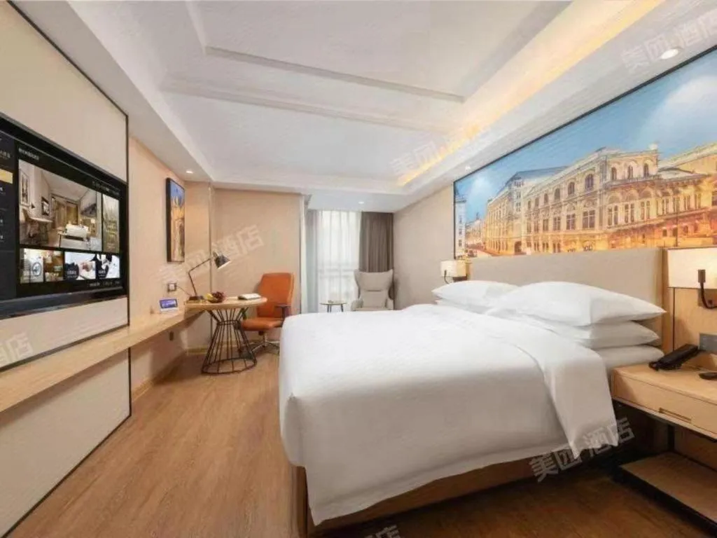 Bed in Vienna International Hotel Guangzhou Baiyun Dayuanli Plaza