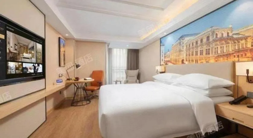 Bed in Vienna International Hotel Guangzhou Baiyun Dayuanli Plaza