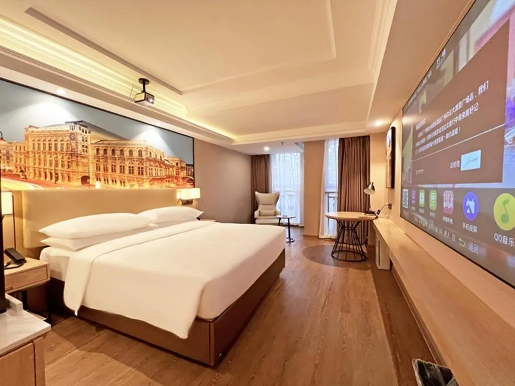 Bed in Vienna International Hotel Guangzhou Baiyun Dayuanli Plaza