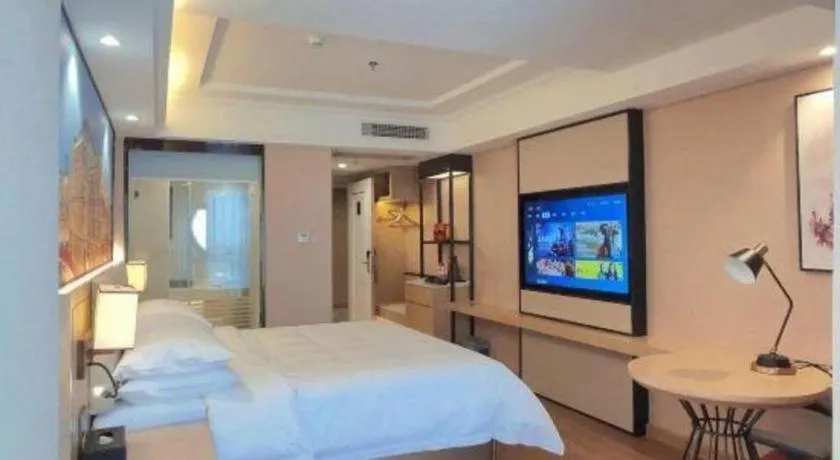 Bed in Vienna International Hotel Guangzhou Baiyun Dayuanli Plaza