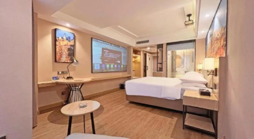 Bed in Vienna International Hotel Guangzhou Baiyun Dayuanli Plaza