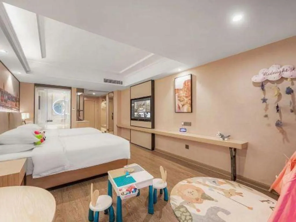 Bed in Vienna International Hotel Guangzhou Baiyun Dayuanli Plaza