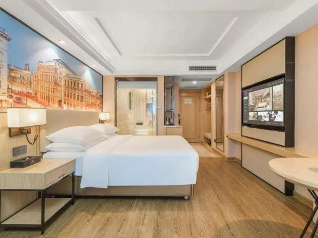 Bed in Vienna International Hotel Guangzhou Baiyun Dayuanli Plaza