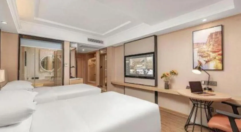 Bed in Vienna International Hotel Guangzhou Baiyun Dayuanli Plaza