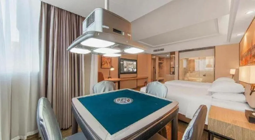 Bed in Vienna International Hotel Guangzhou Baiyun Dayuanli Plaza