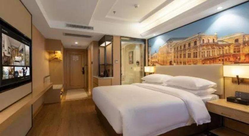 Bed in Vienna International Hotel Guangzhou Baiyun Dayuanli Plaza