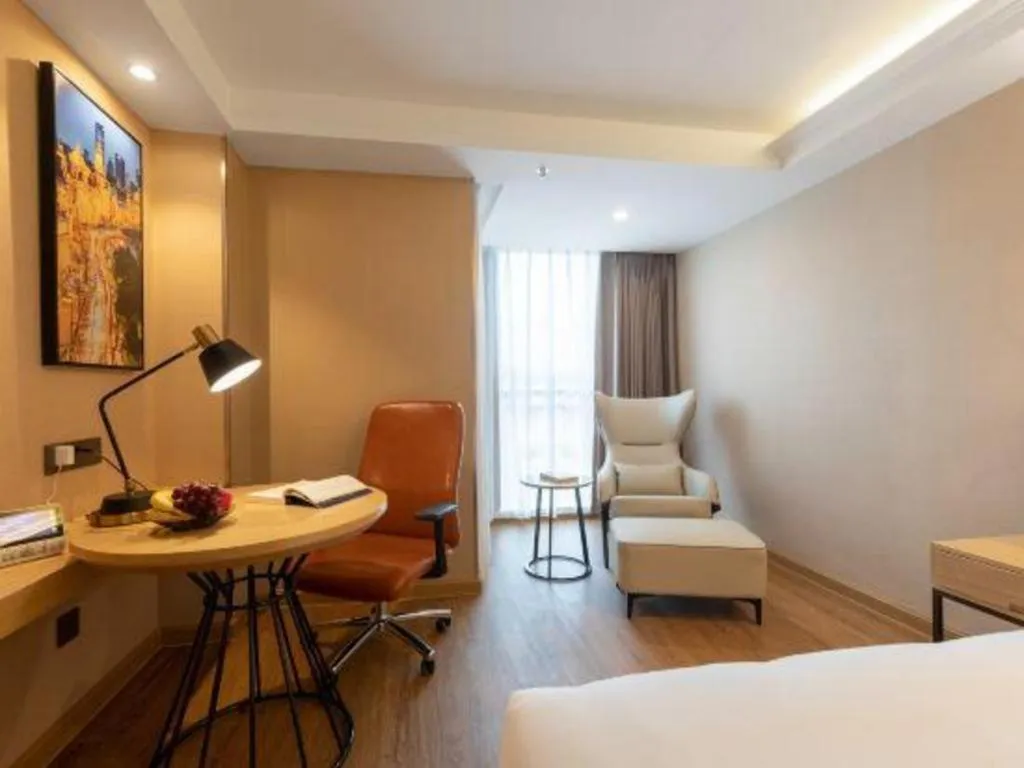 Bed in Vienna International Hotel Guangzhou Baiyun Dayuanli Plaza