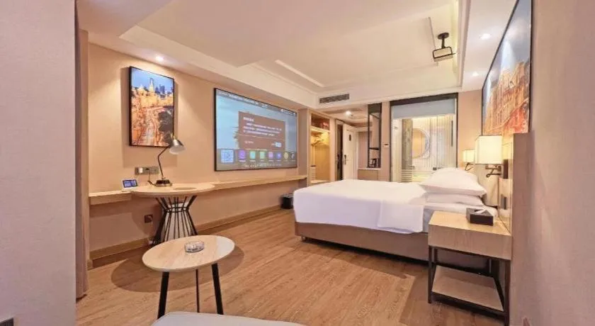 Bed in Vienna International Hotel Guangzhou Baiyun Dayuanli Plaza