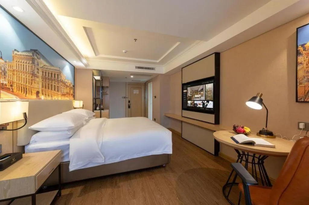 Bed in Vienna International Hotel Guangzhou Baiyun Dayuanli Plaza