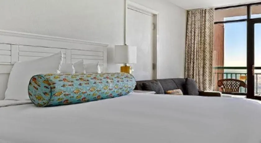 Bed in Sand Castle Resort by Patton Hospitality