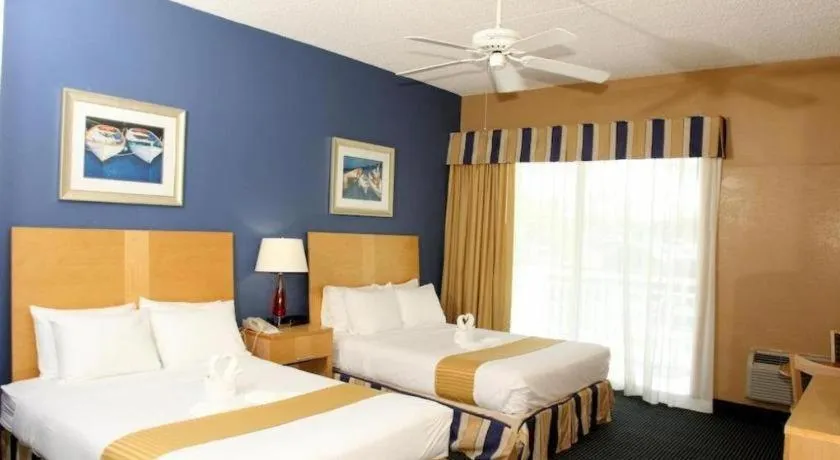 Bed in Chart House Suites and Marina