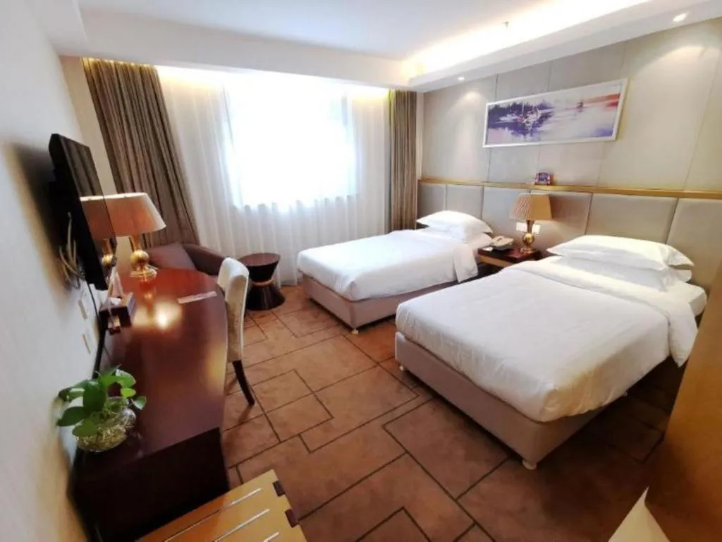 Bed in Jinjiang Metropolo Shanghai Minhang