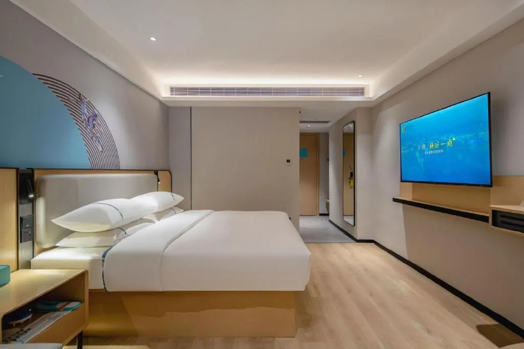 Bed in City Comfort Inn Wuzhou Municipal Square
