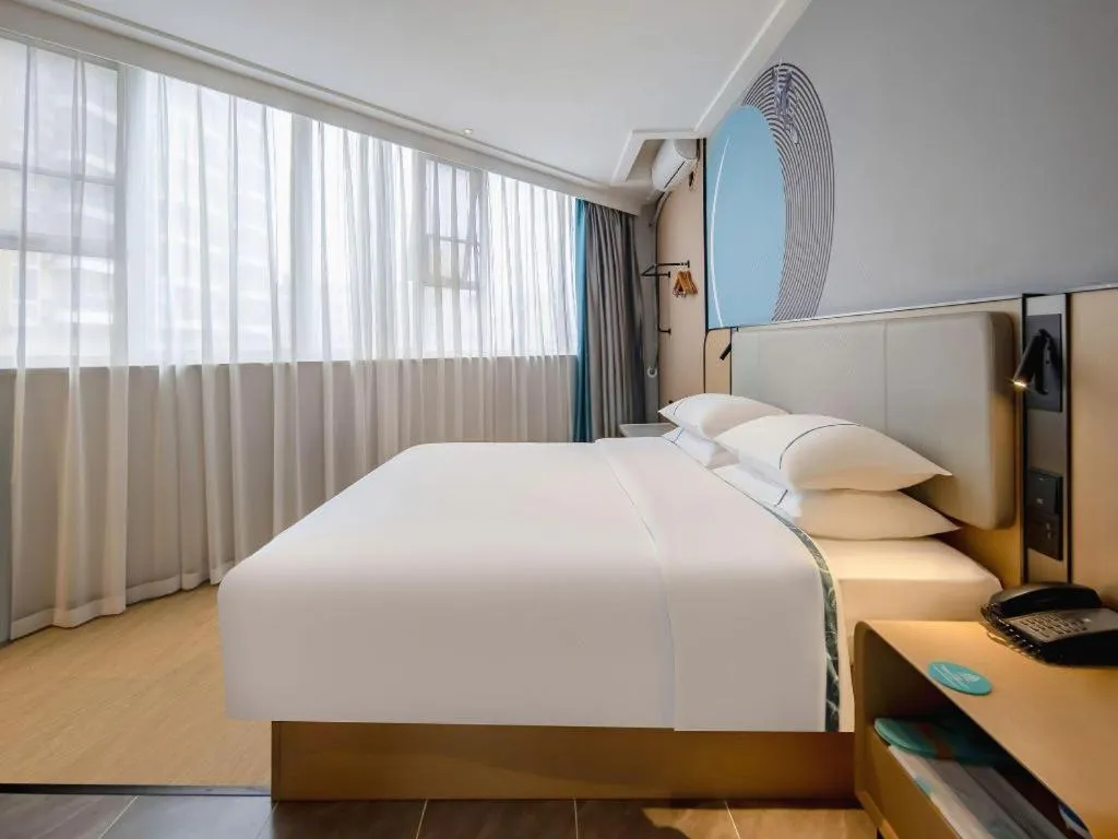 Bed in City Comfort Inn Wuzhou Municipal Square