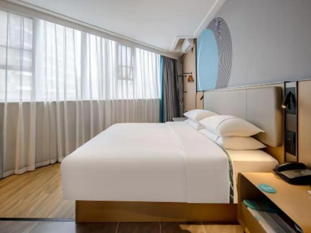 Bed in City Comfort Inn Wuzhou Municipal Square